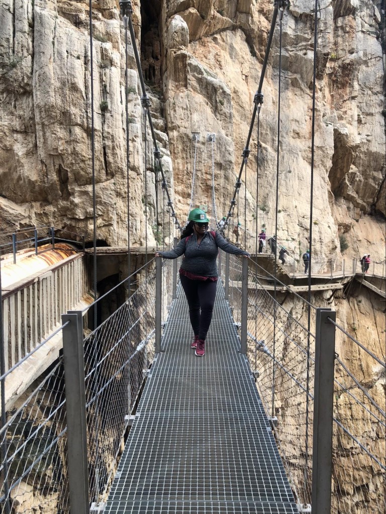 Woman crossing a bridge on the Caminito del Rey