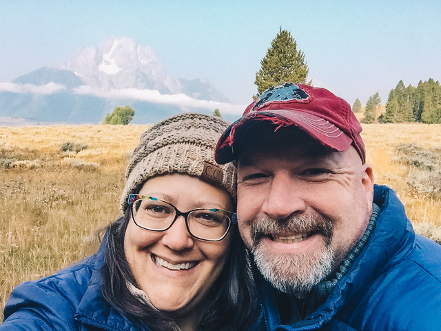 A happy couple taking a selfie at Grand Teton National Park
