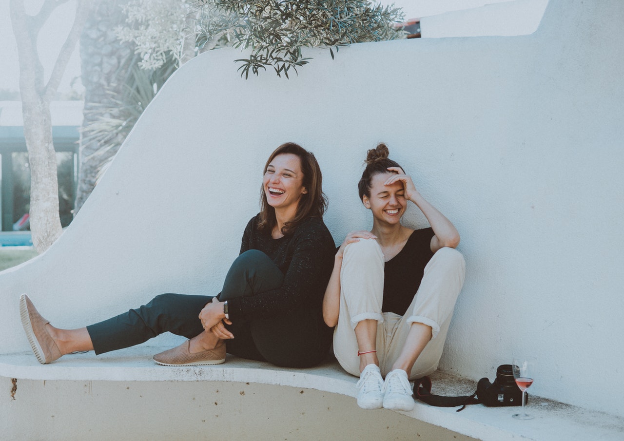 two female friends laughing together