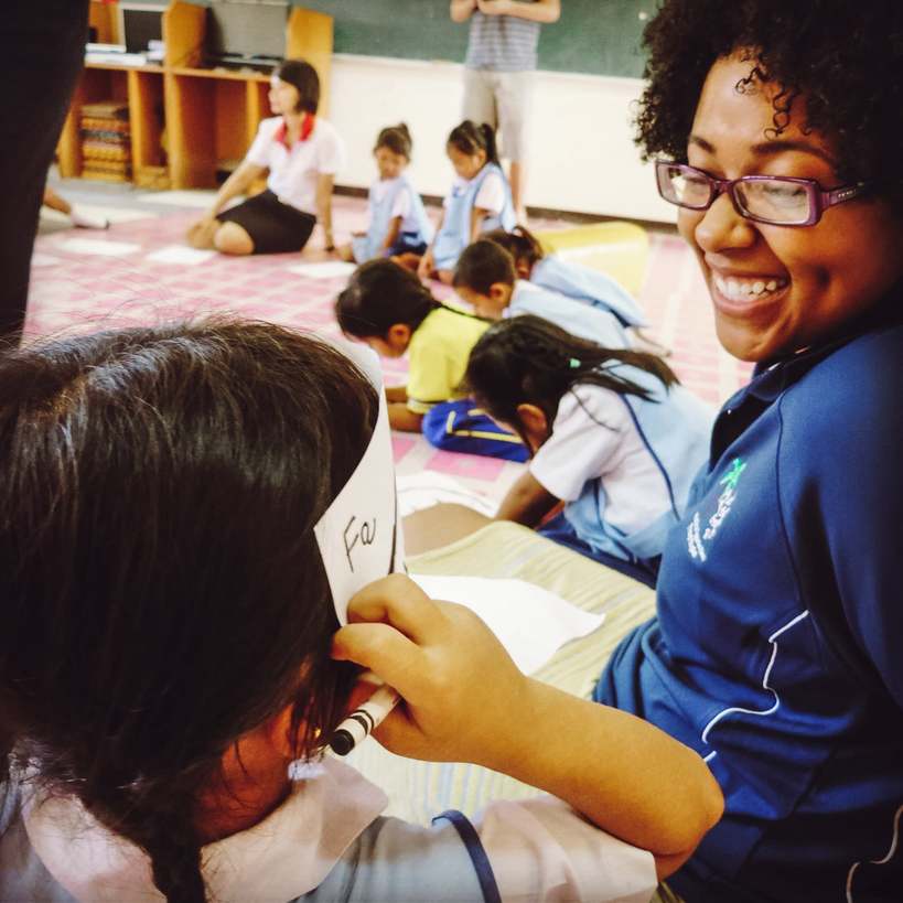 An English teacher in Phuket, Thailand playing a game with her students.