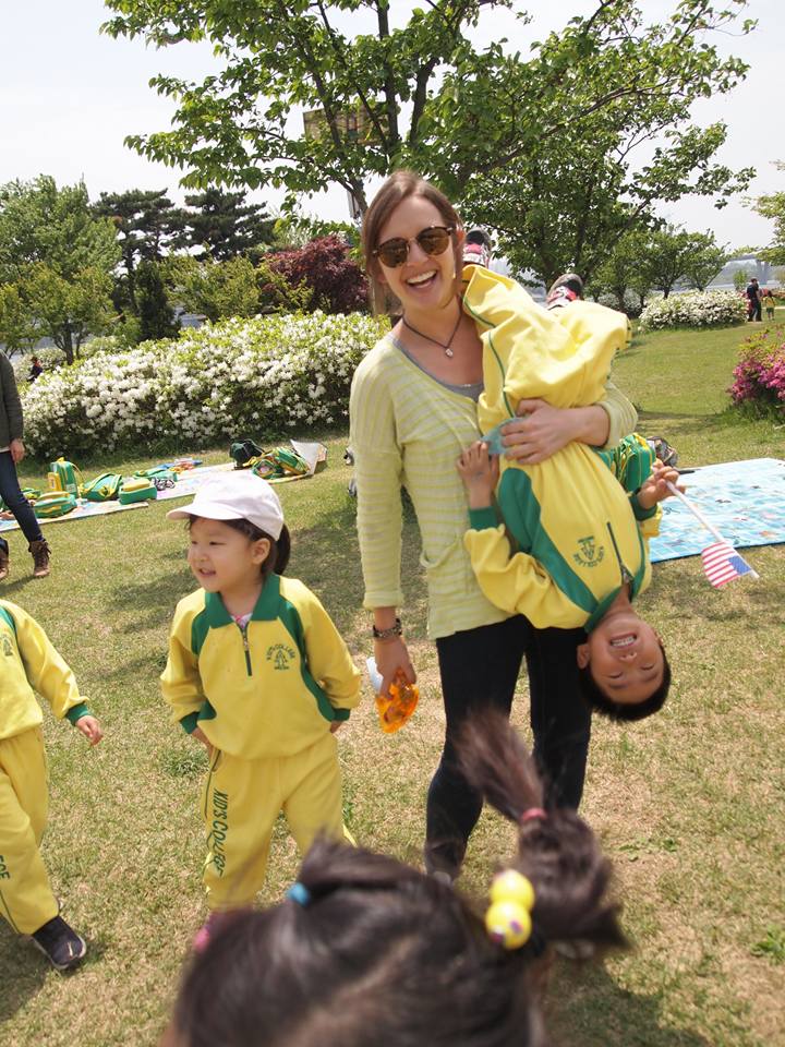teaching holding a student at a field trip in guri, south korea