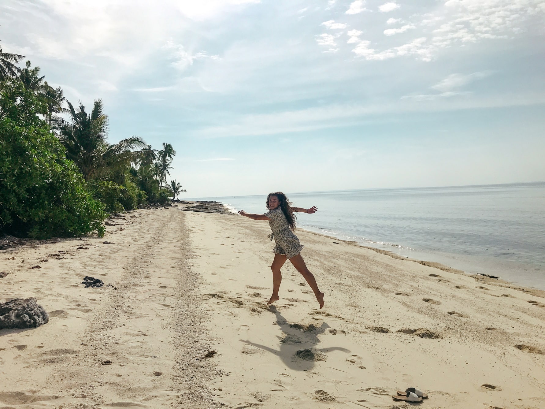 Happy girl running at Kalanggaman, Philippines