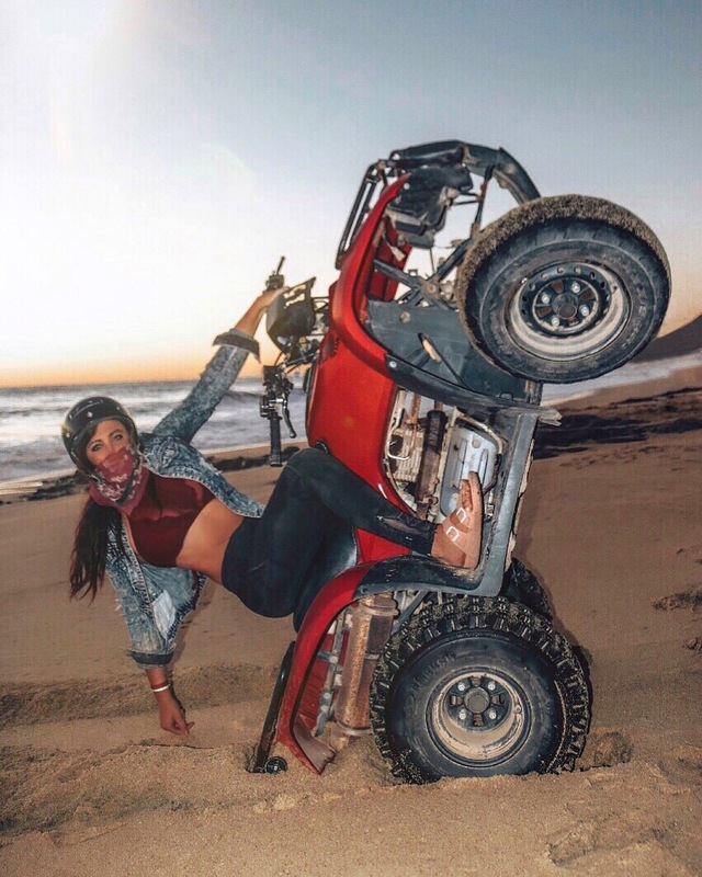 A spring break destination rep posing on four wheeler in Mexico