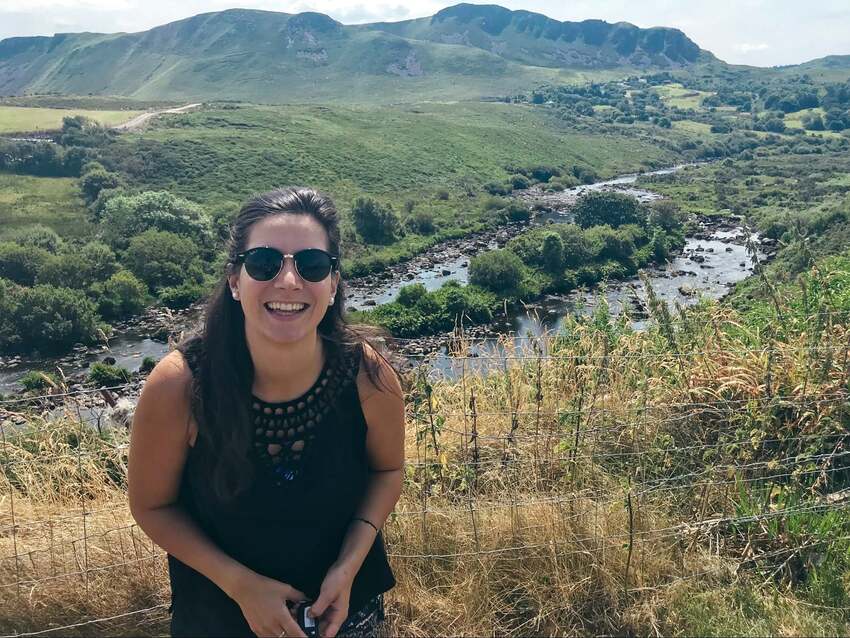 Smiling German expat living abroad in Ireland enjoying the Irish countryside