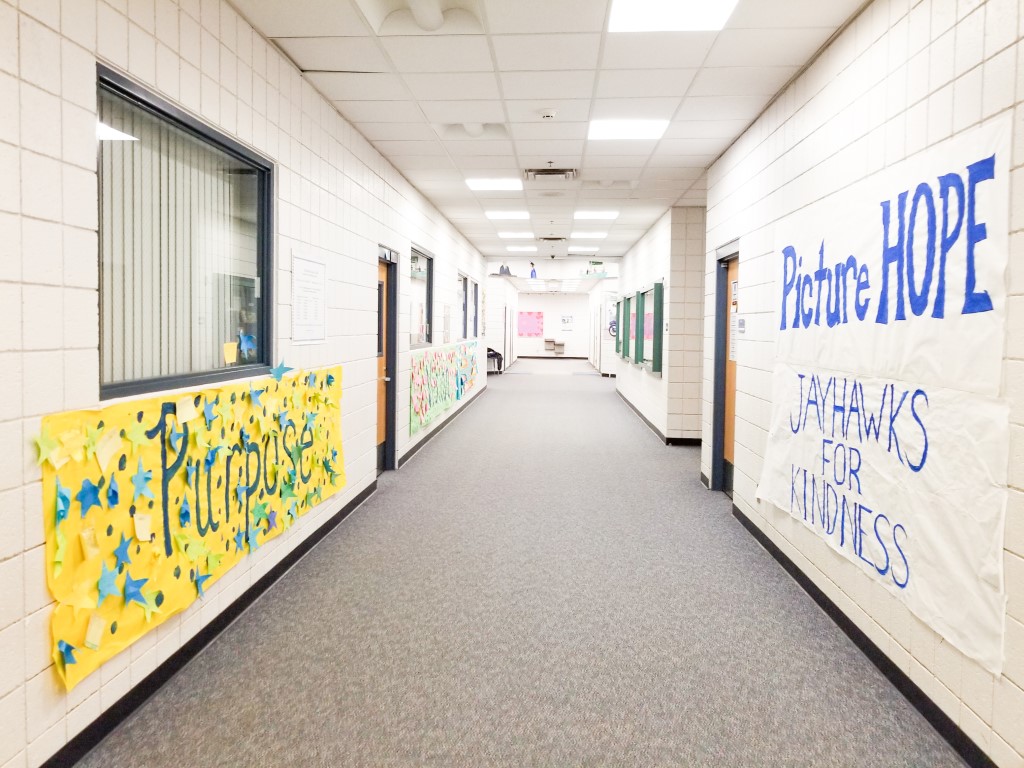 the white hallways with hand painted banners in my elementary school