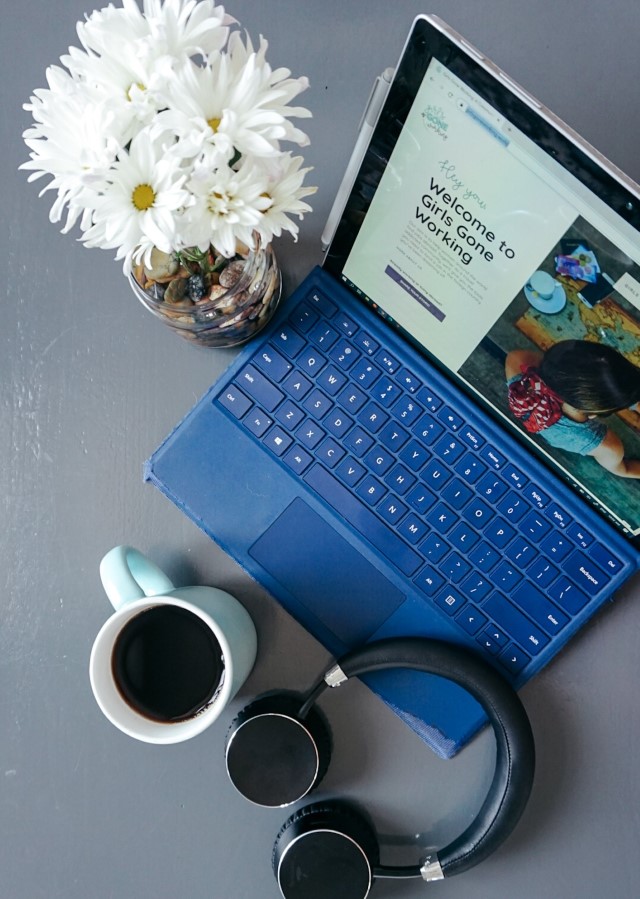 flatlay image of flowers, laptop, headphones and coffee- the basics to starting your online career!