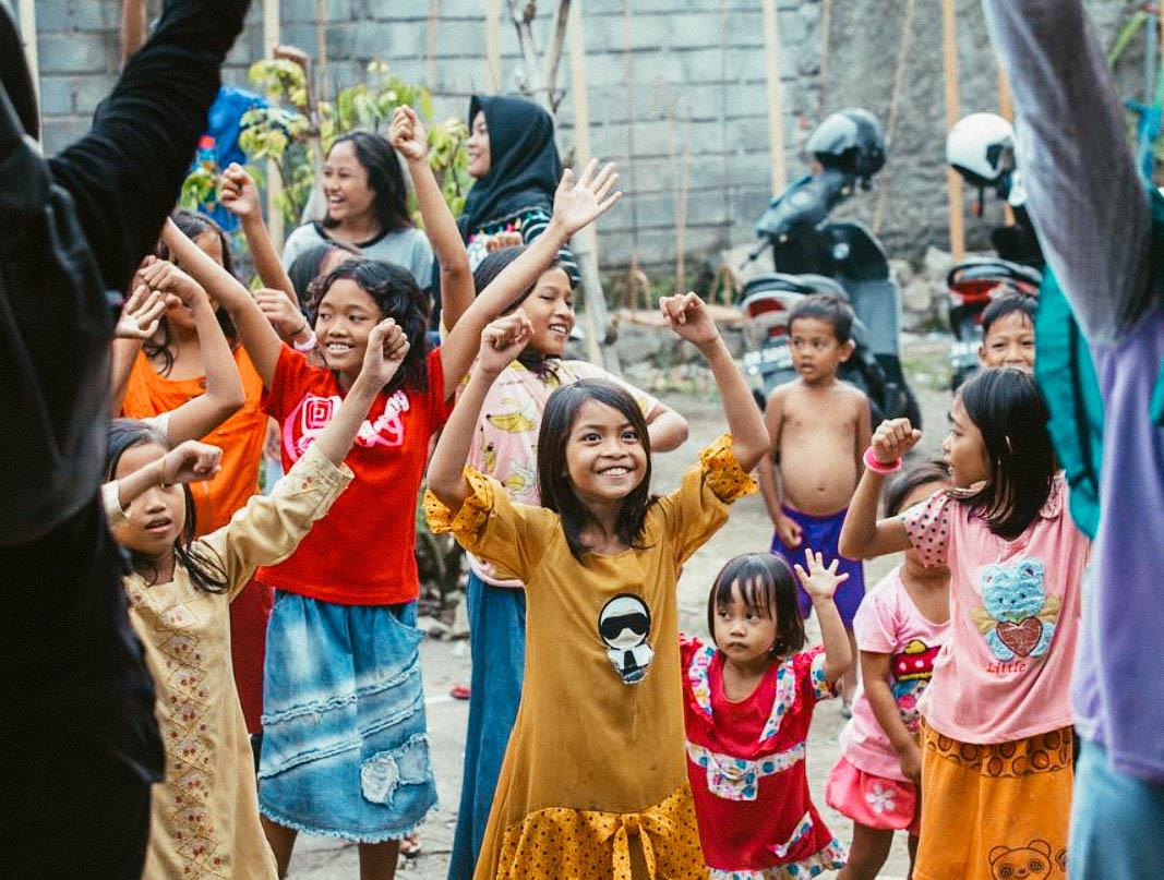 young children dancing at a Nomads Giving Back! volunteer event in Bali, Indonesia
