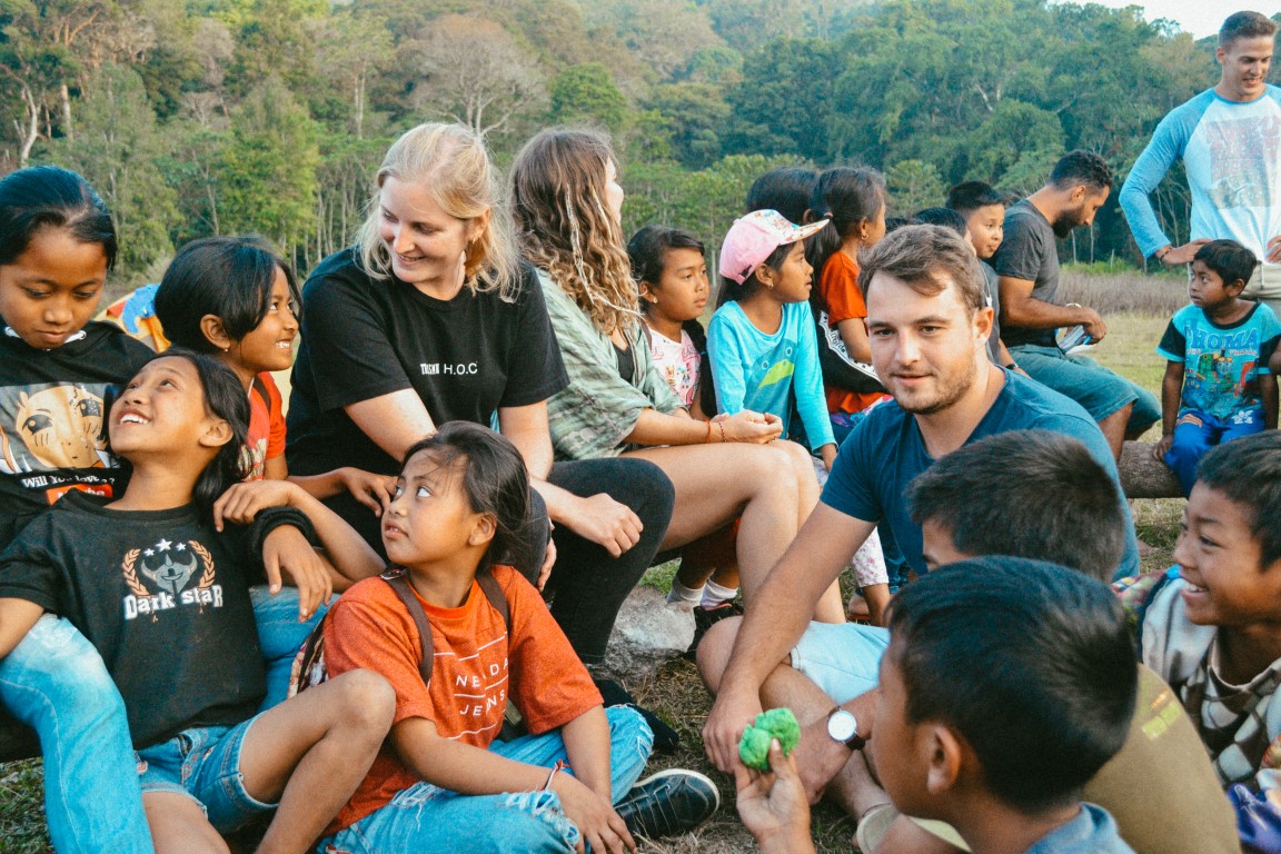 A group of Nomads Giving Back! volunteers hosting a language exchange program