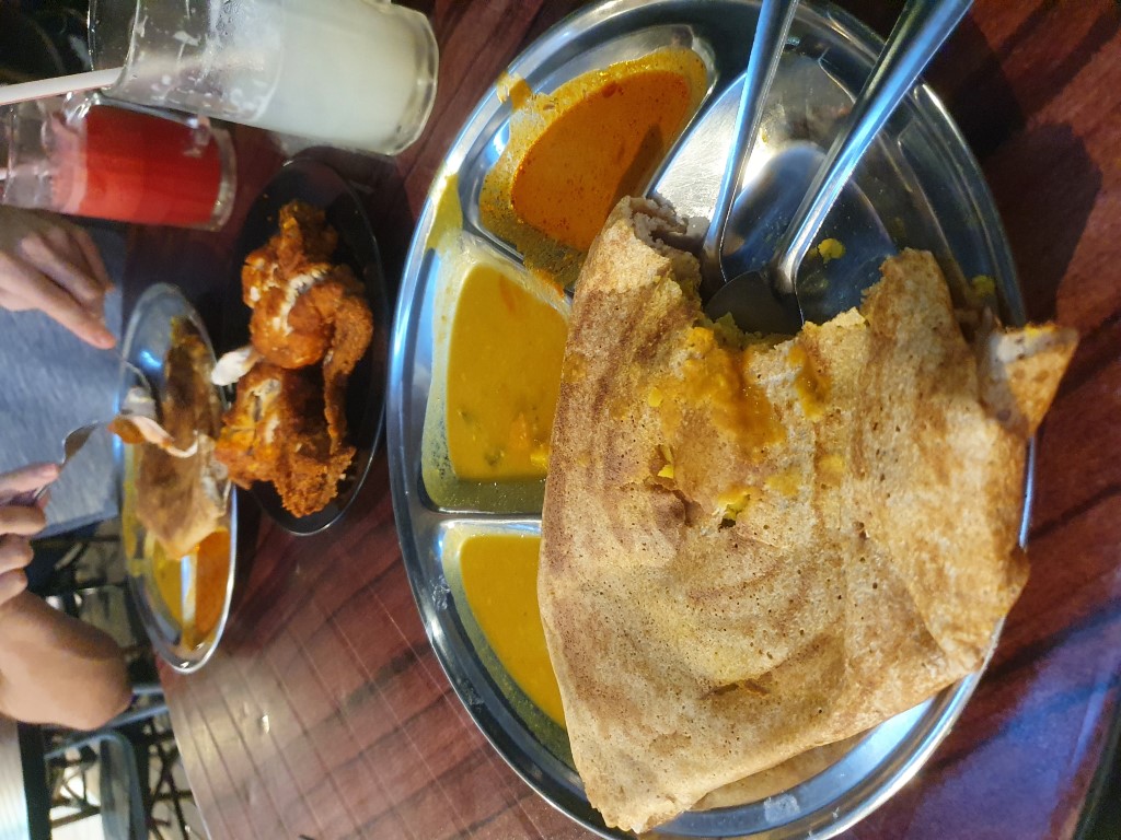 Breads, curries and chicken at a Kedai Mamak Husin in Bukit Bintang