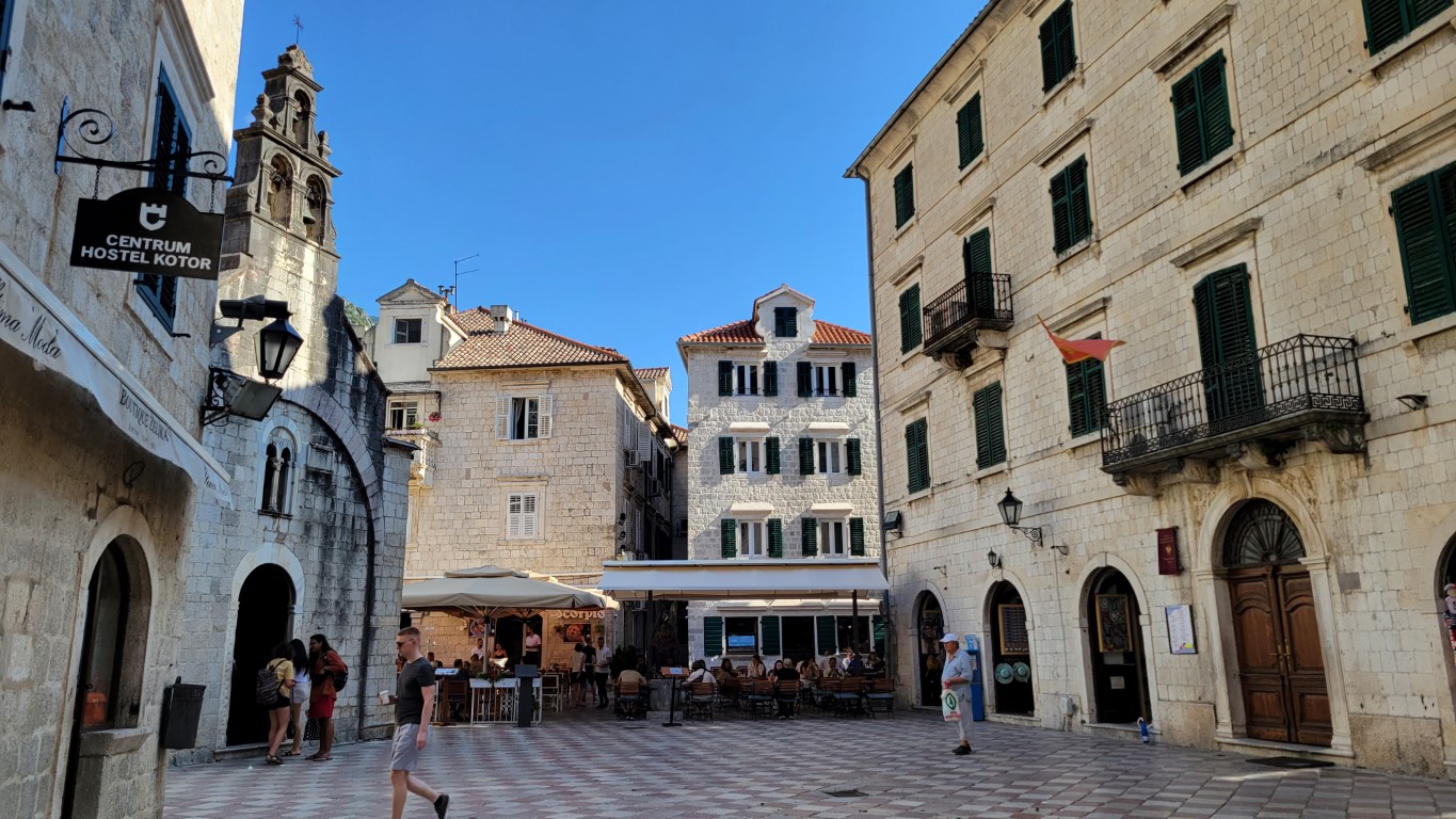 a semi-empty plaza in old town Kotor with its venetian architecture still intact