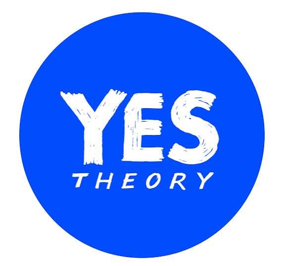 White text reading 'YES THEORY' in brushstroke style on a solid bright blue circular background.