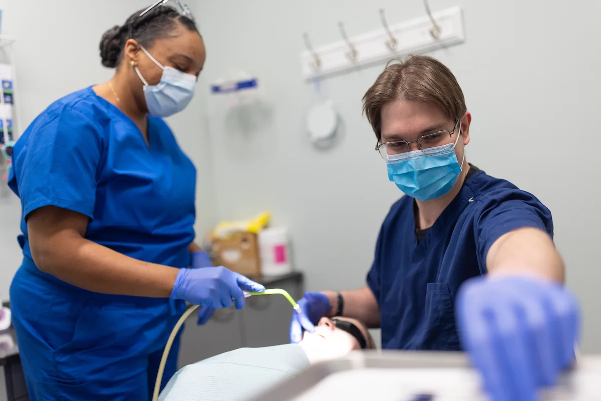 Family holding tooth brushes