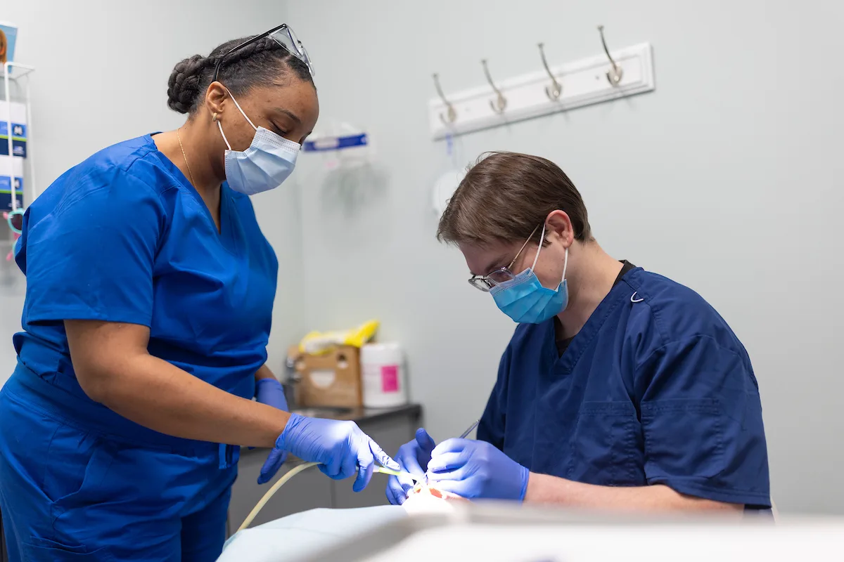 man holding his knocked out tooth