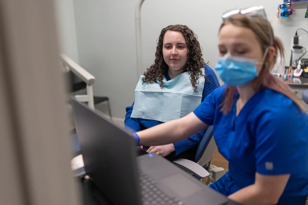 Family holding tooth brushes