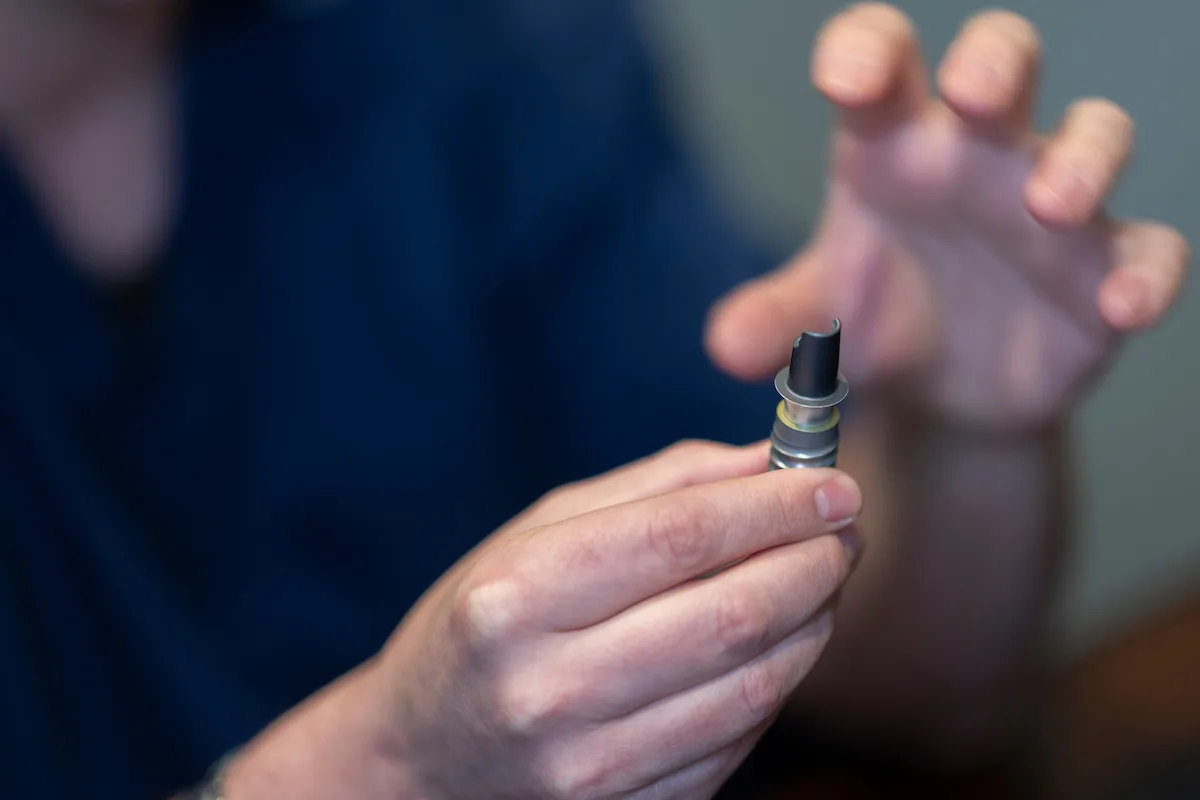 dentist showing little boy how to brush his teeth!