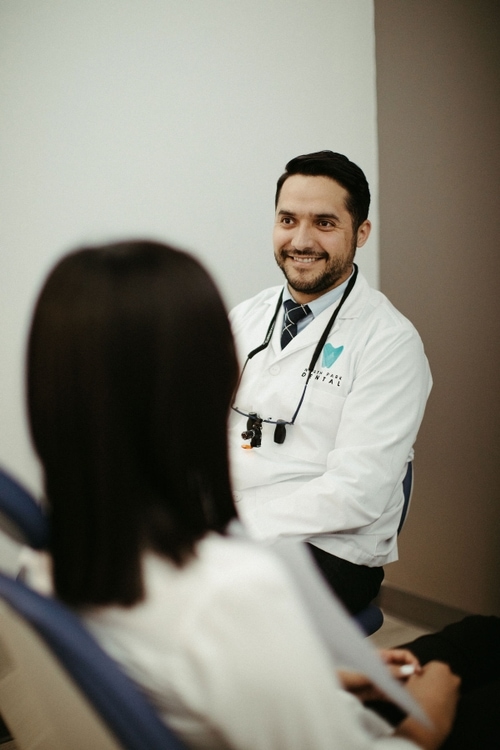 Pediatric assistant smiling with child