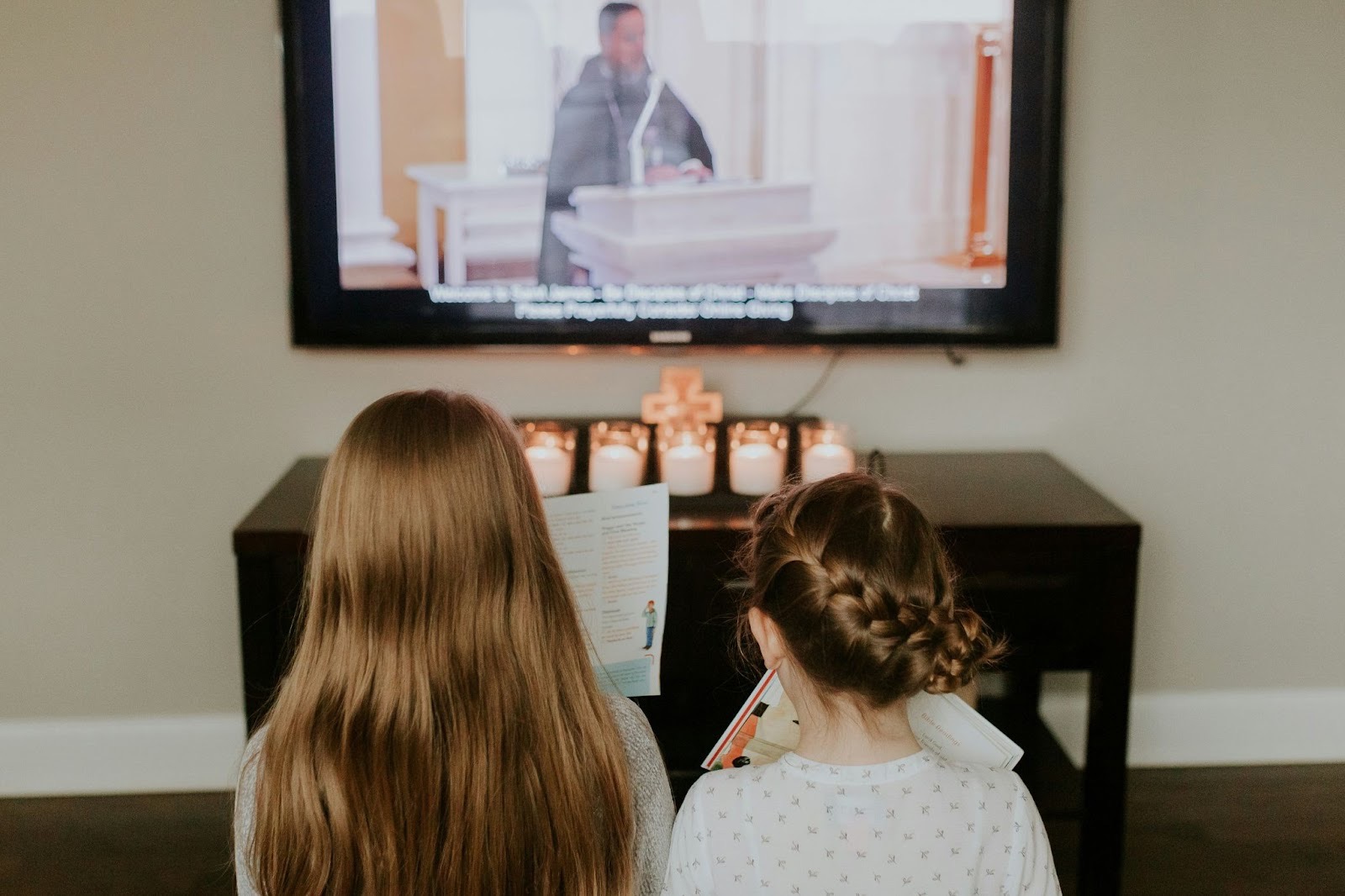 Child watching educational video content on a screen, illustrating how church media and curriculum are delivered through digital church software.