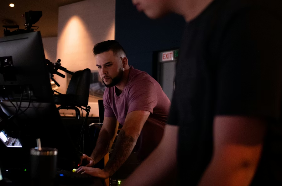 A church volunteer working in a church production booth.