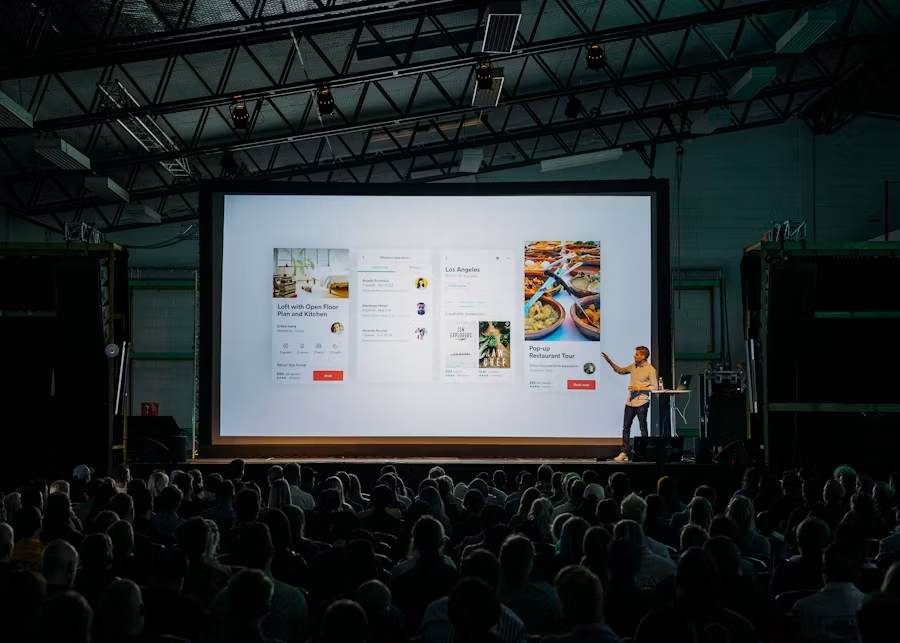 A big screen in a church environment used for a conference.