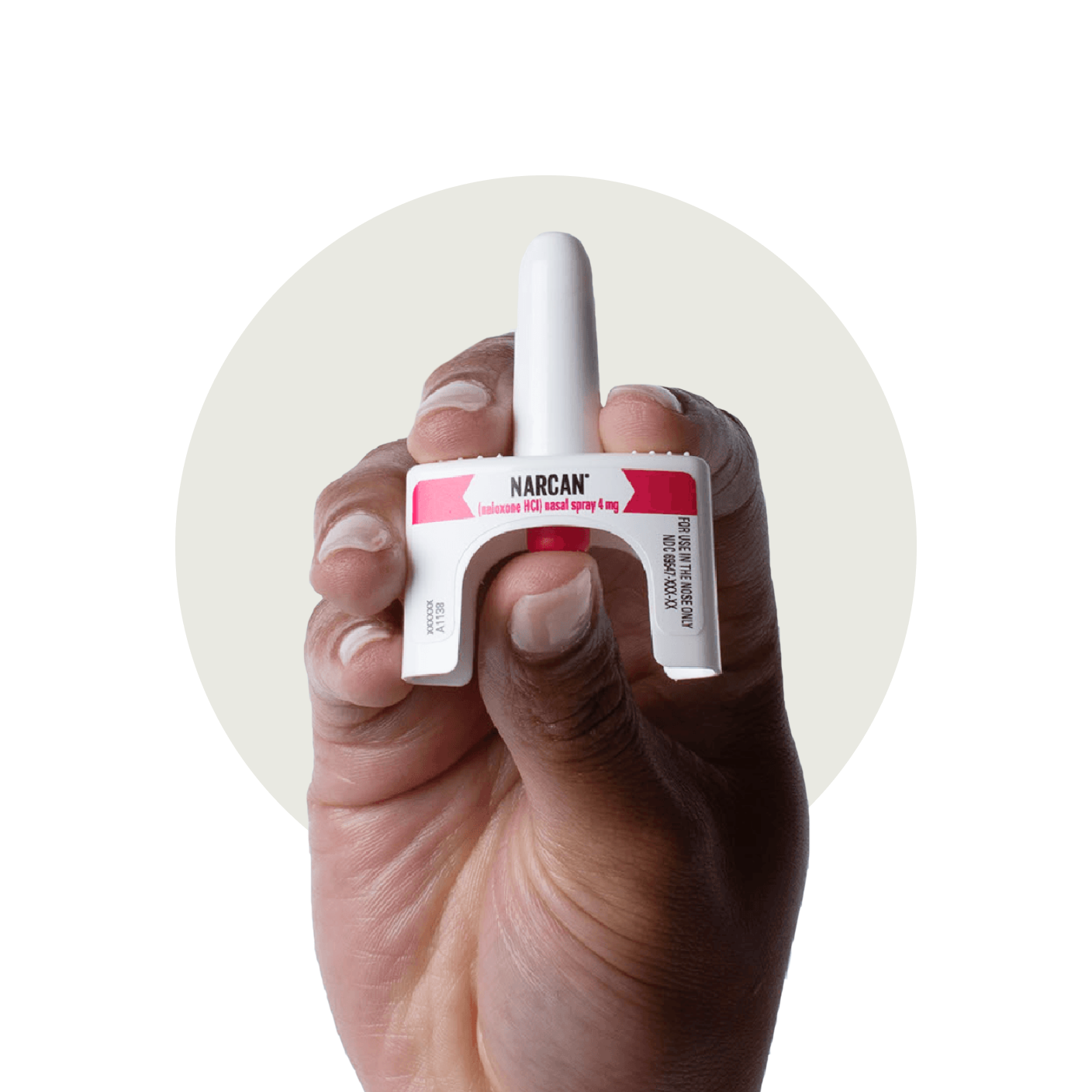 A hand that has pressed a nasal spray device