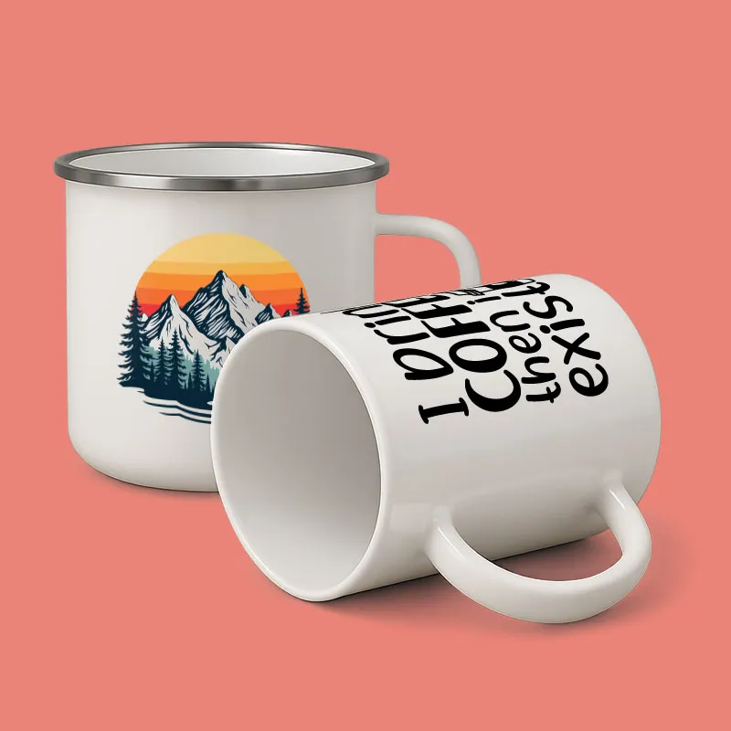 A white coffee mug with a mountain scene on it.