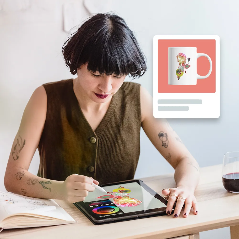 Woman using tablet with stylus and mug design on screen and background.