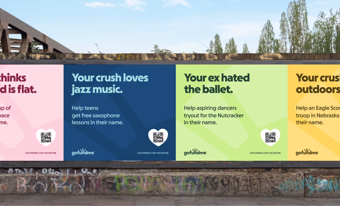 A row of wheat paste posters depicting a GoFundMe Valentines campaign in the new brand.