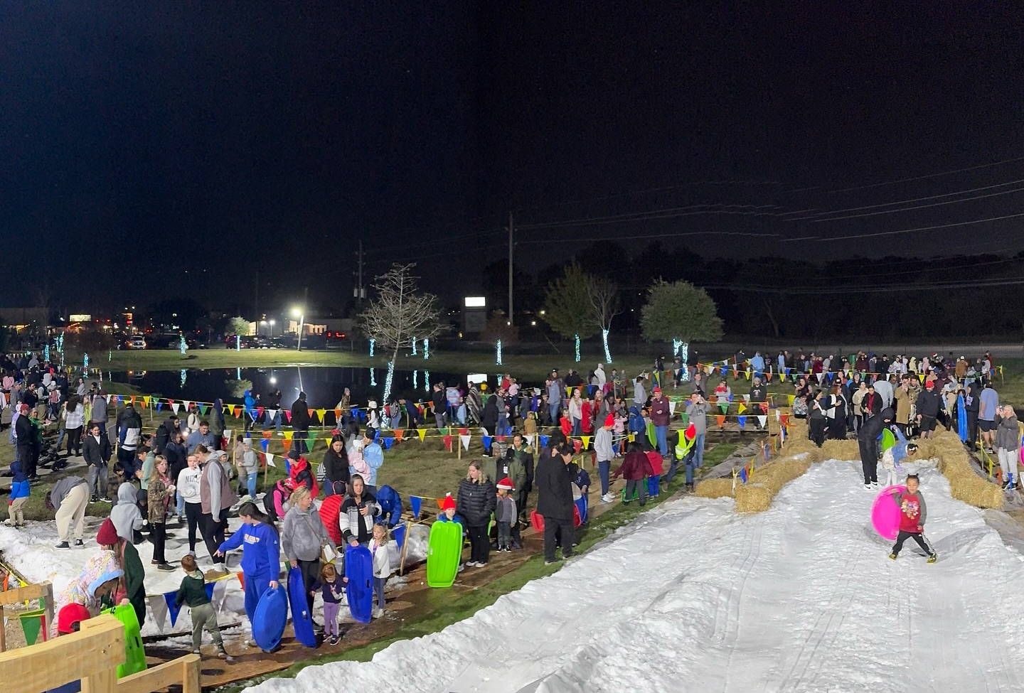 Kids sledding on the snow hill