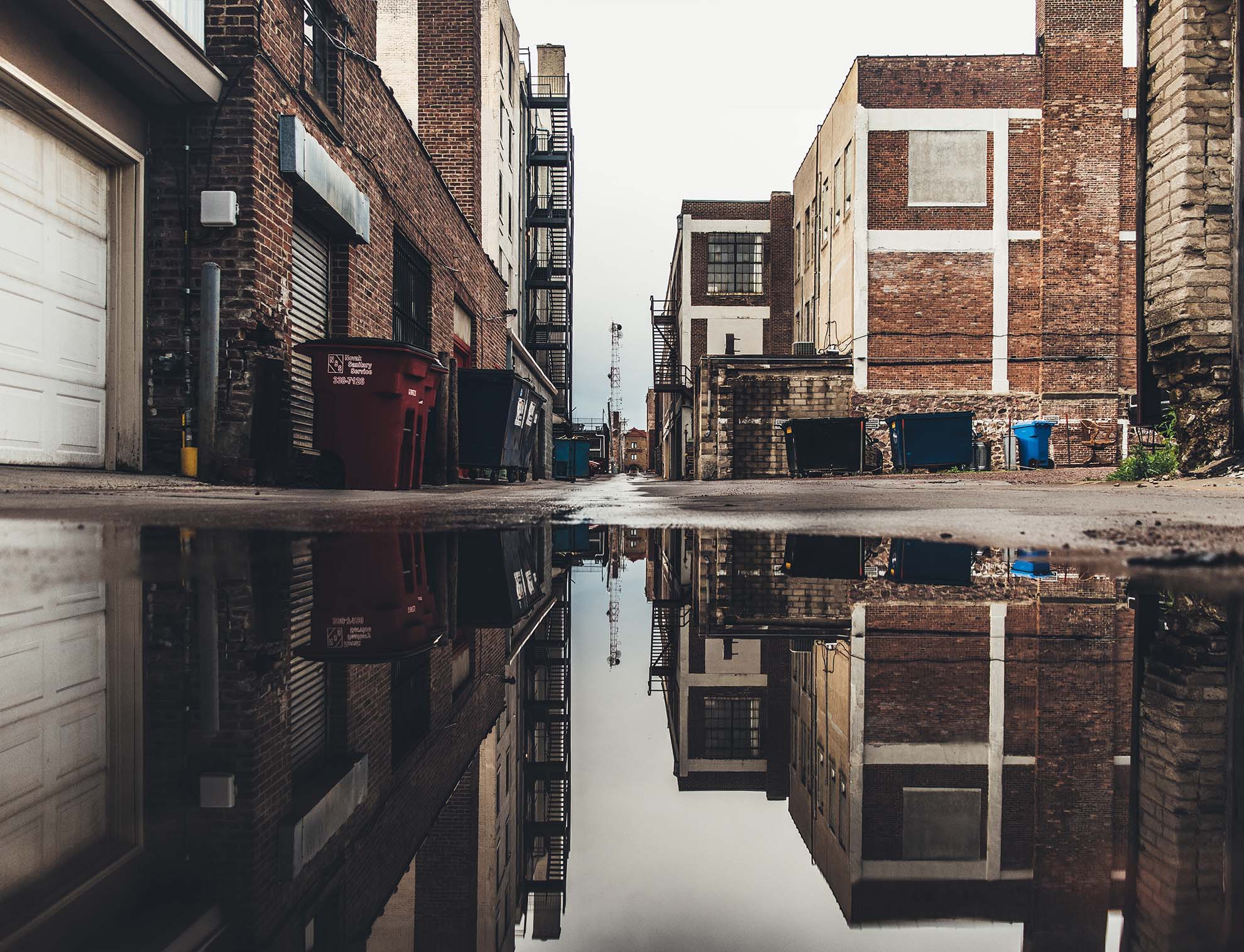 A photo of a back alley in an urban setting
