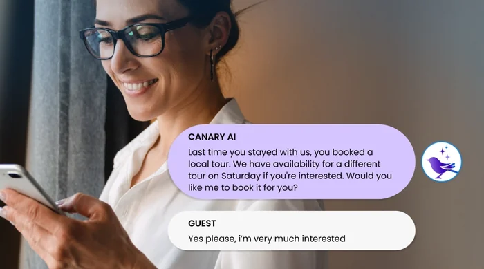 Hotel guest reading a Canary AI message on her phone that offers to book a local tour