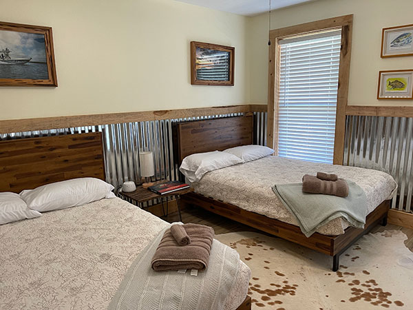 Image of bedroom with two double beds.