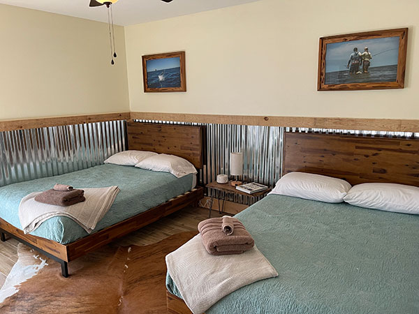 Image of bedroom with two double beds.