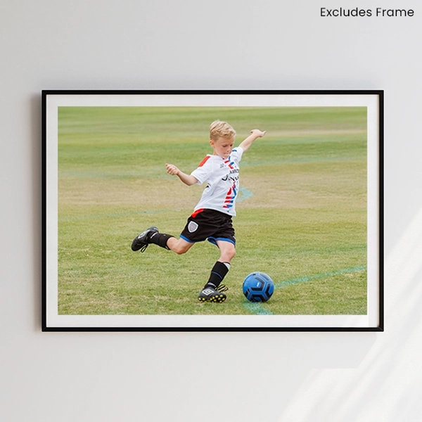 Photo poster with white border which is framed and hanging on a wall