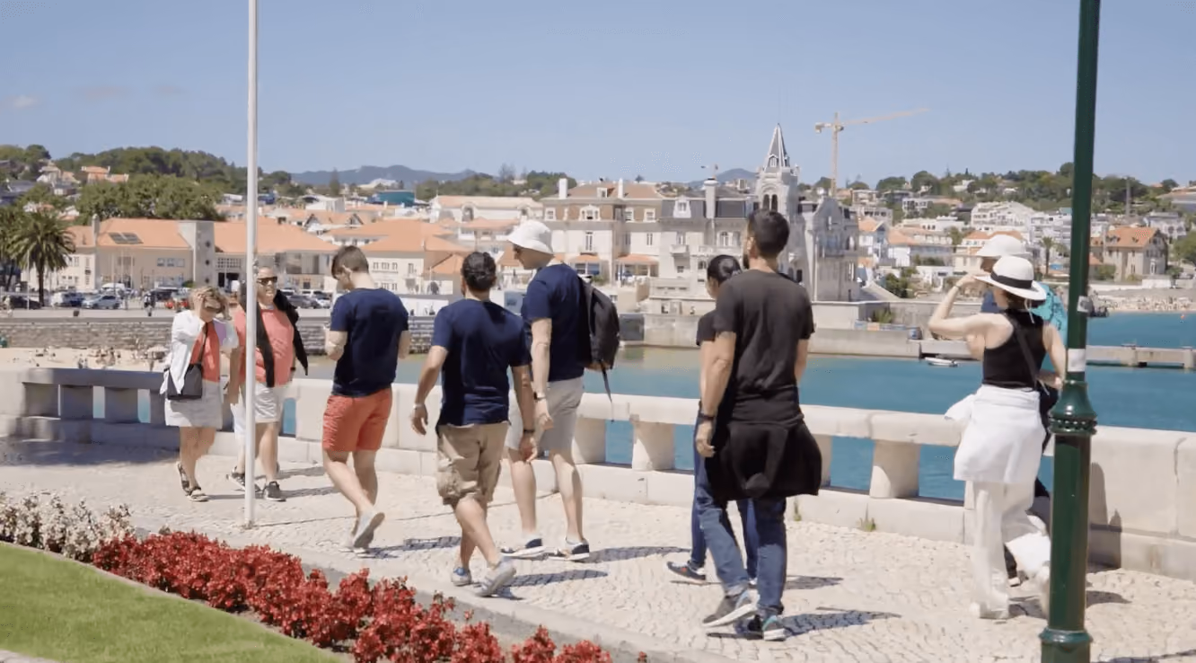 Group walking together on their company retreat in Portugal
