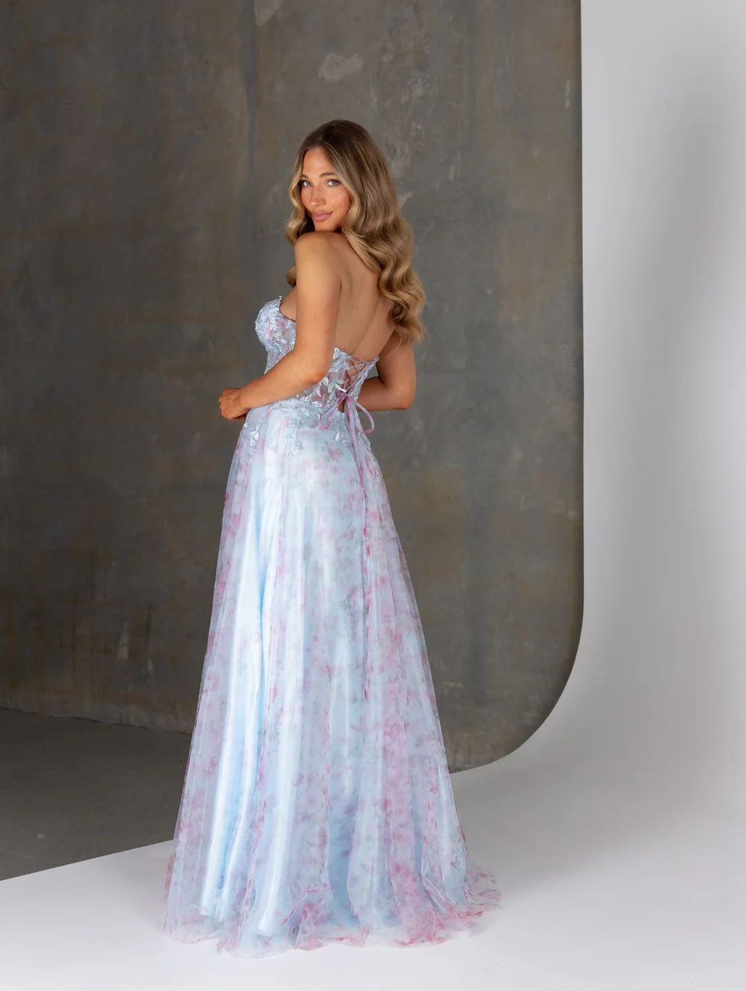 Ethereal and elegant, our Heather strapless formal dress by Tania Olsen Designs is crafted from delicate 3D lace and flowing tulle for a romantic, statement-making look.