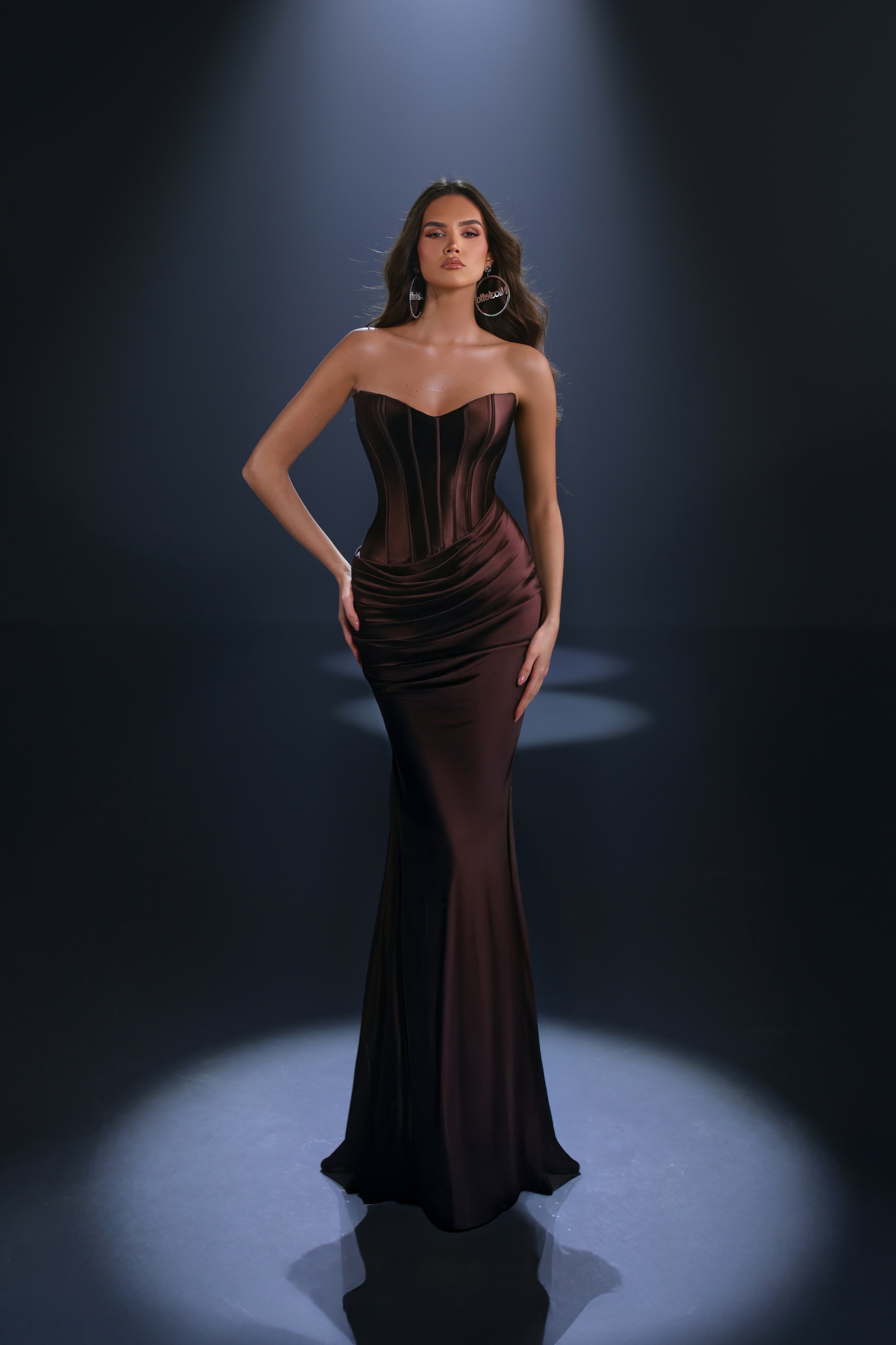 Style NC4113 in Chocolate is designed to sculpt and flatter, with a structured bodice and soft draping that enhances every curve. The deep brown tone adds a touch of understated luxury — elegant without trying too hard.