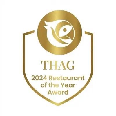 A colorful logo for the THAG organization.