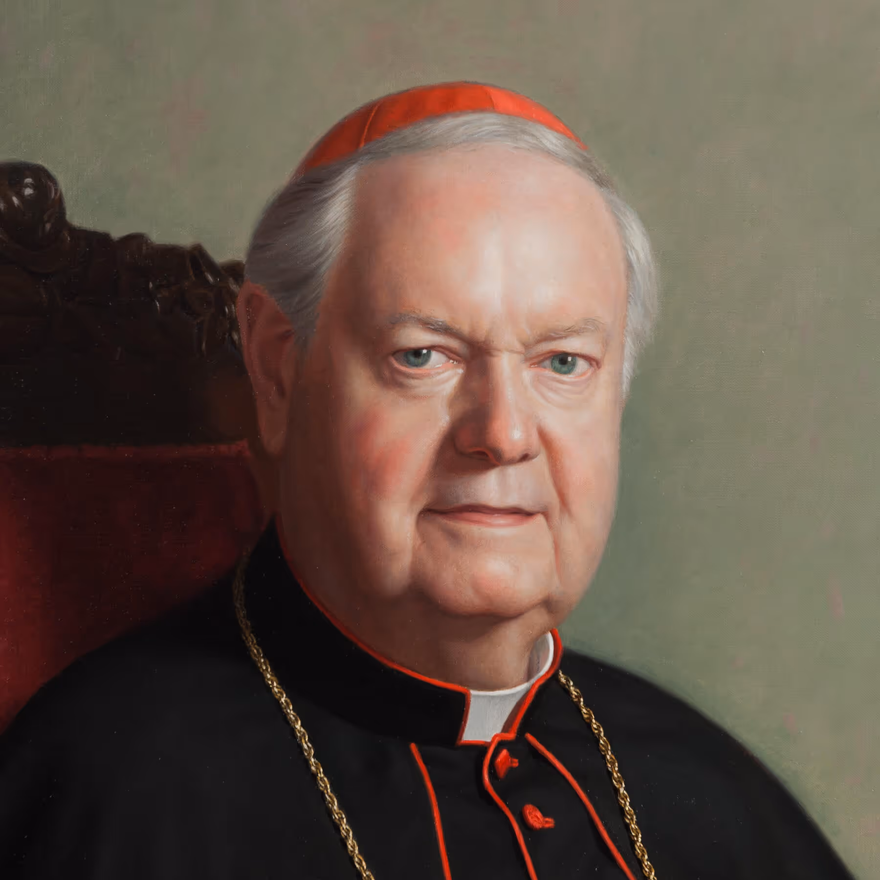 Detail of official clergy portrait showing the face and expression of Edward Cardinal Egan in ceremonial vestments.