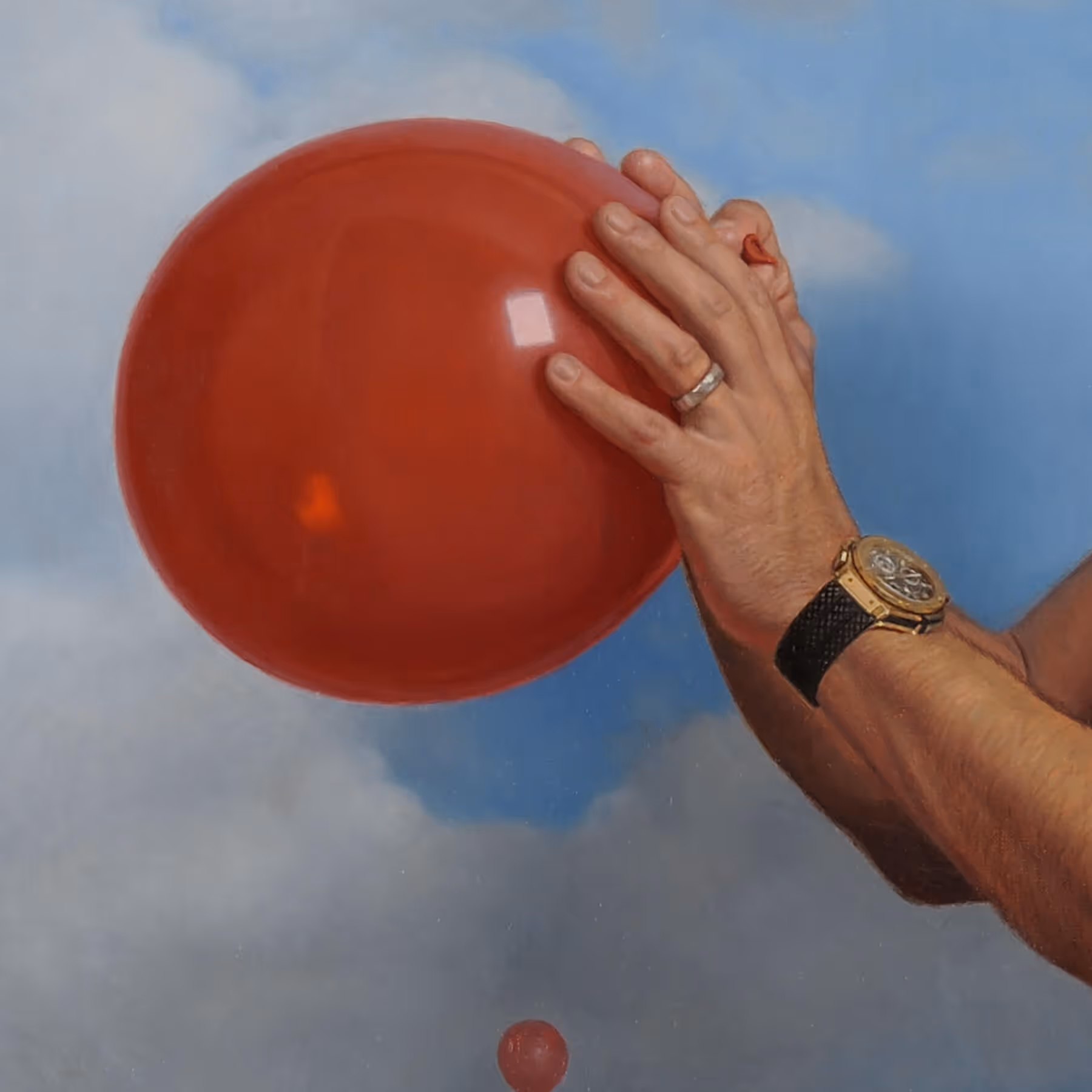 Detail of Patrick’s hands holding a red balloon, a symbolic element within the portrait.
