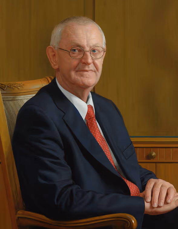 Detail of Wil de Hollander seated in the Velcro Industries boardroom, showing posture, business attire, and chair design.