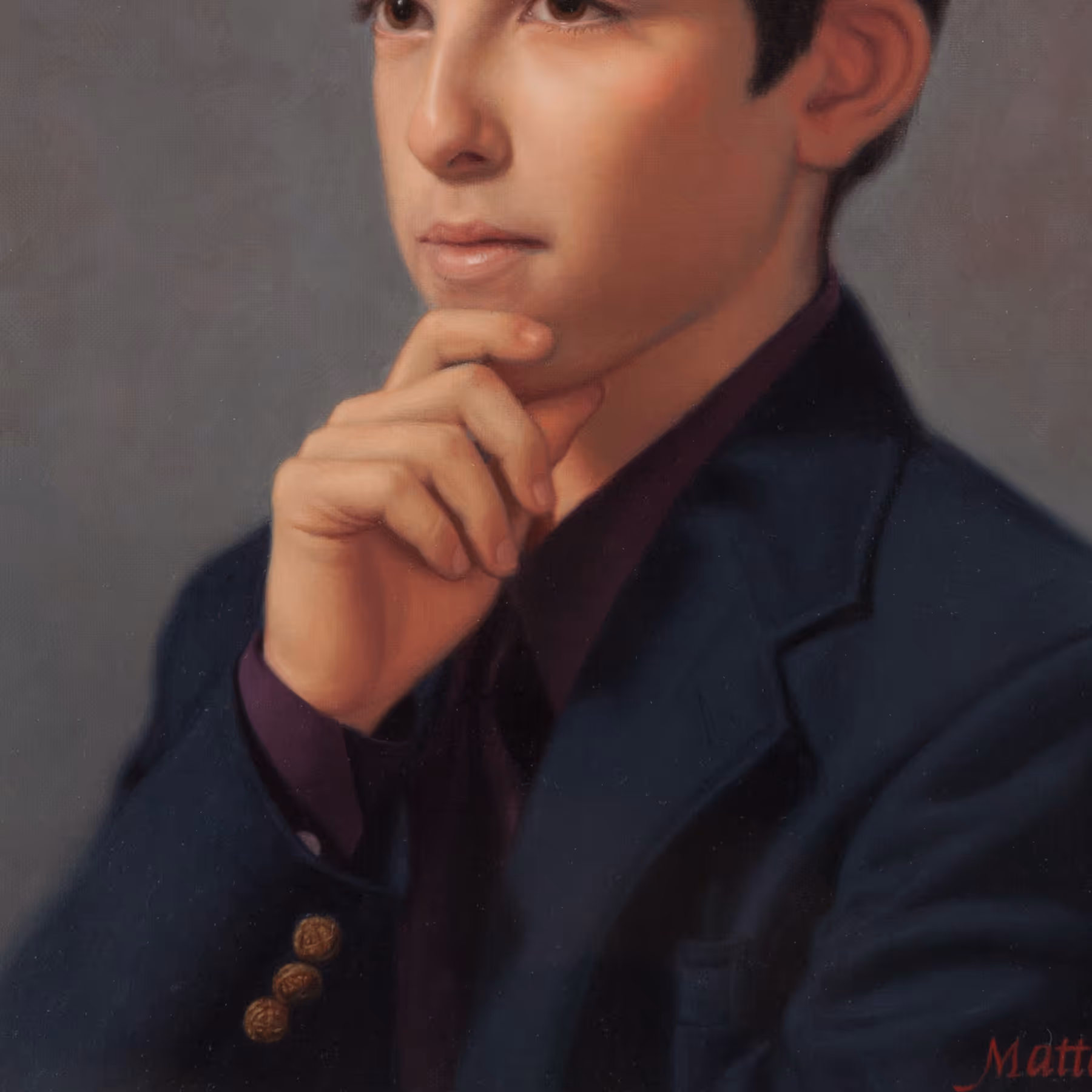 Detail of Michael’s hand, navy jacket, and contemplative pose showing subtle light and shadow relationships.