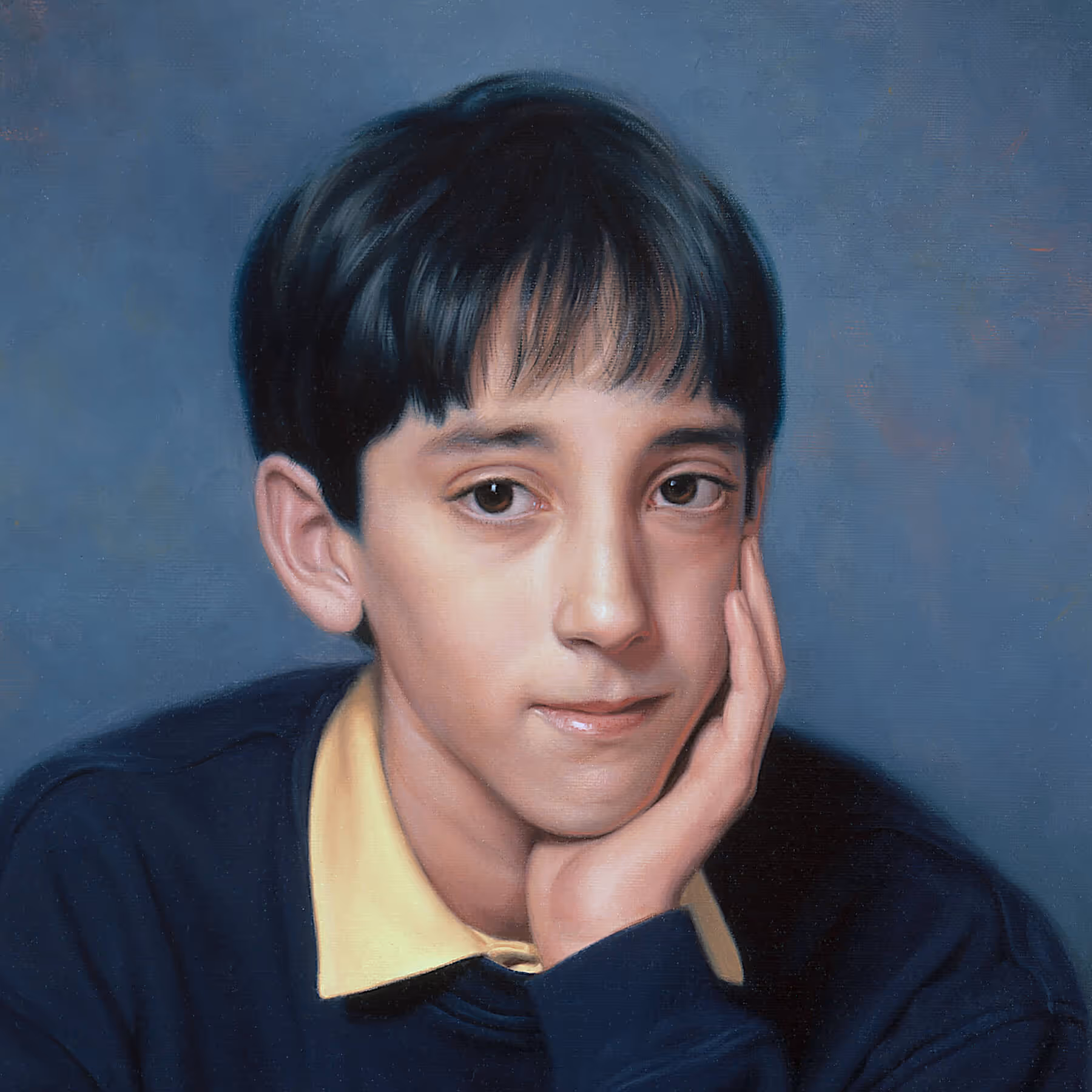 Close-up portrait detail of Jamie showing facial features, hand gesture, and blue-gray background.
