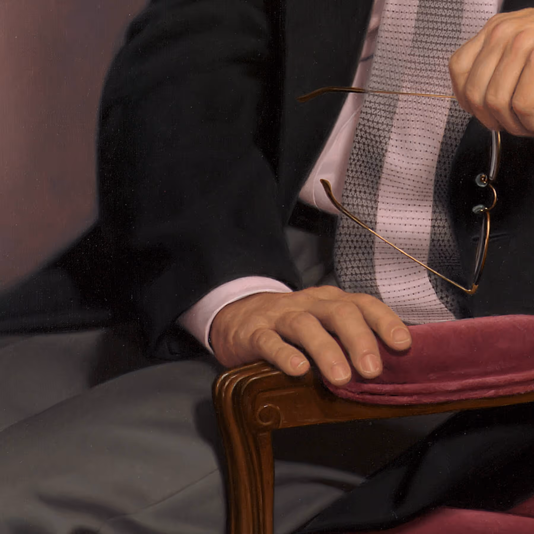Hand and antique chair detail in collector’s portrait of Stephen Fishback
