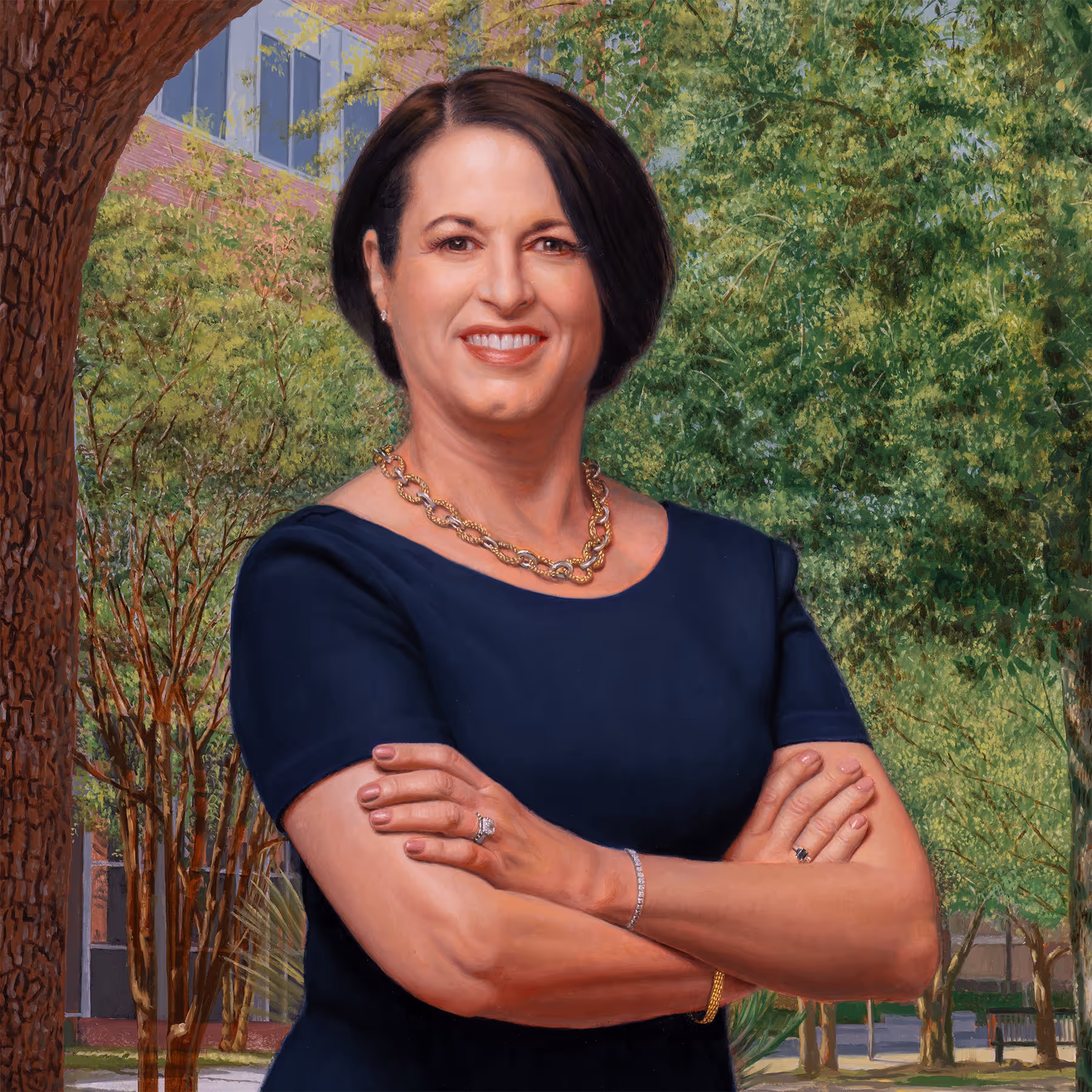 Portrait detail of Julie Johnson showing facial features, folded arms, and natural outdoor lighting.