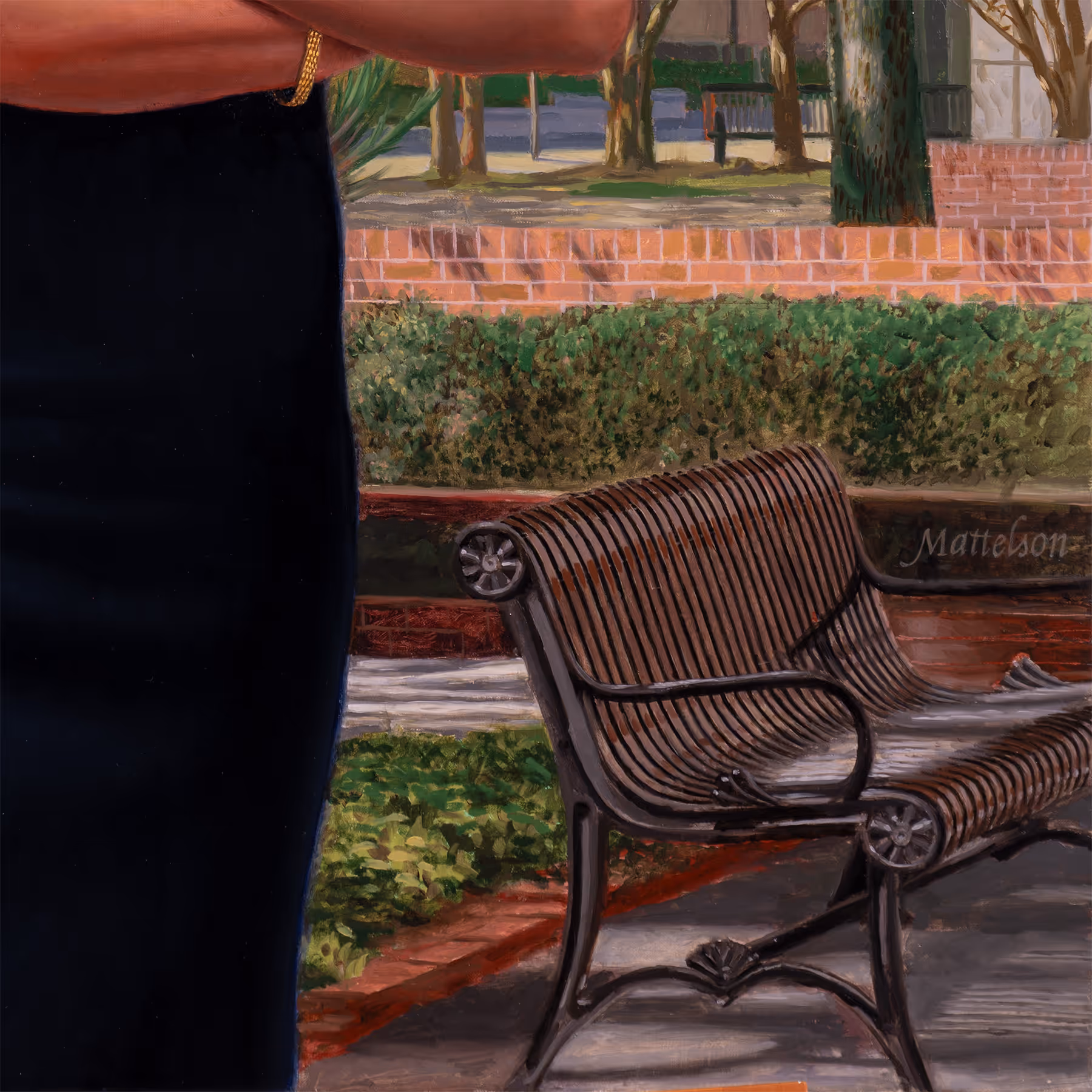 Detail of Julie Johnson standing near a park bench beneath trees.