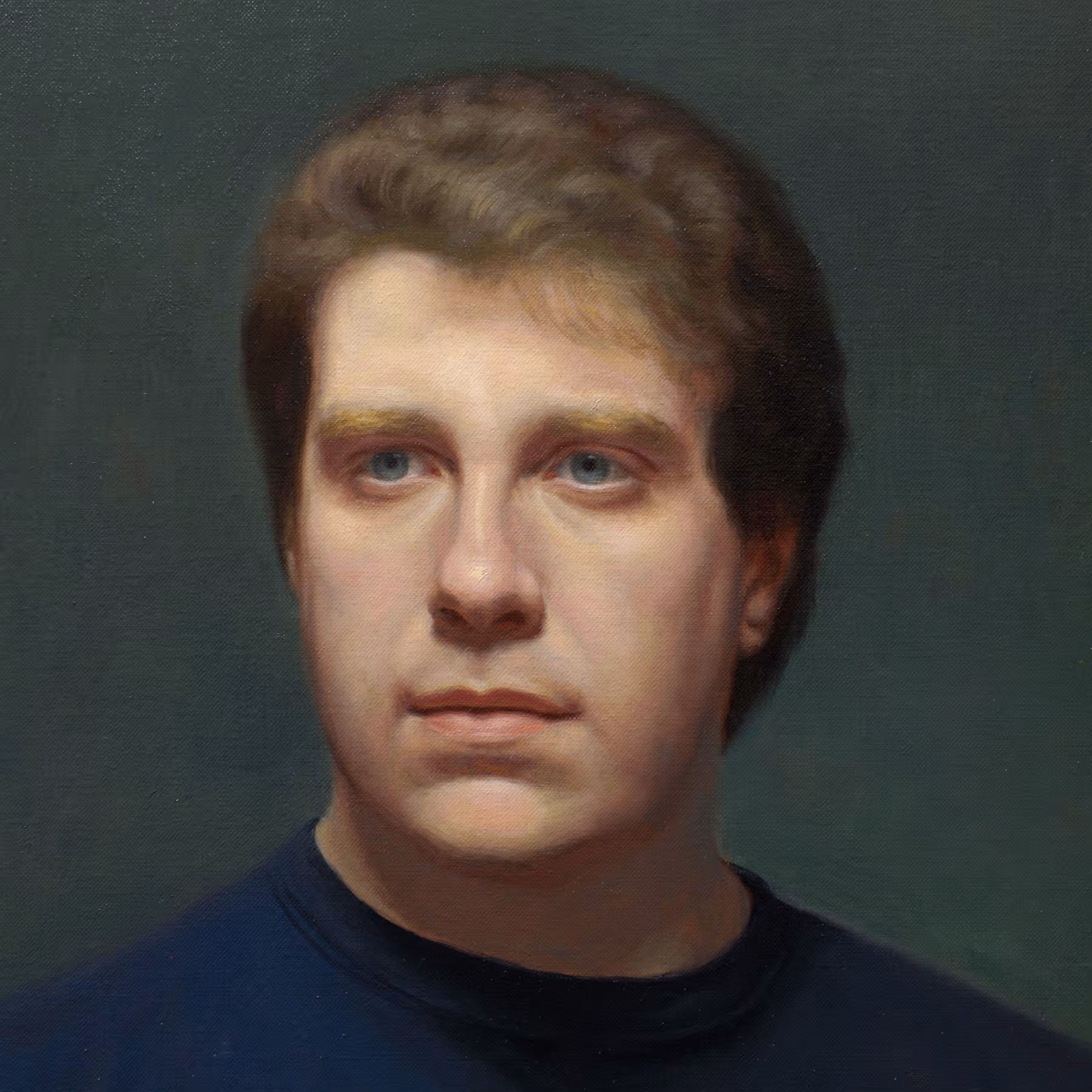 Close-up portrait detail of Dan showing direct gaze, subtle flesh tones, and softly modeled facial features.