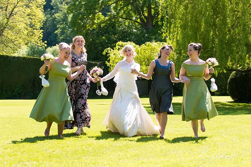 Glen Yr Afon wedding bride and girls running and laughing