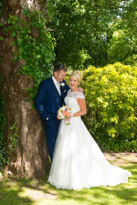 Glen Yr Afon wedding bride & groom by tree