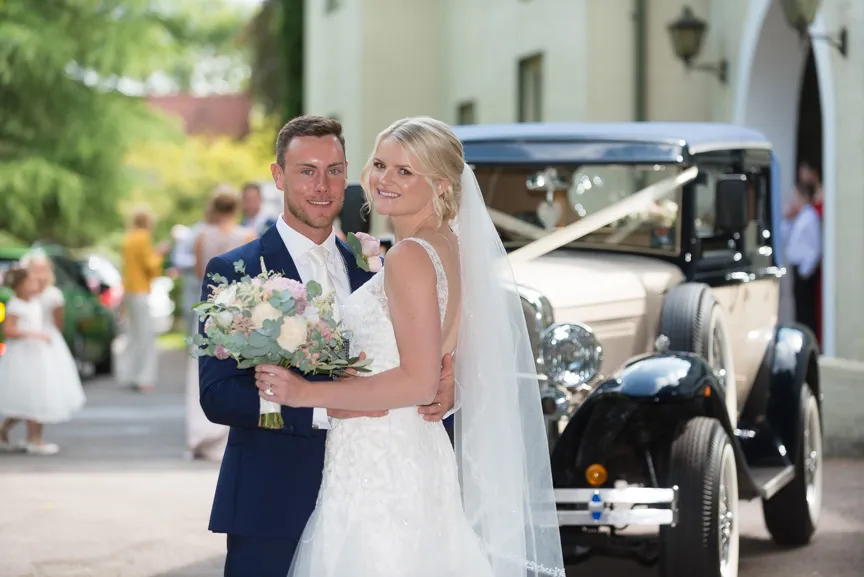 Glen Yr Afon wedding bride & groom with car