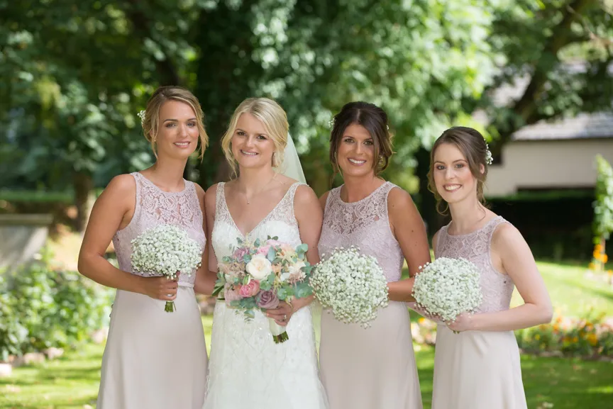 Glen Yr Afon wedding bride and bridesmaids on lawn